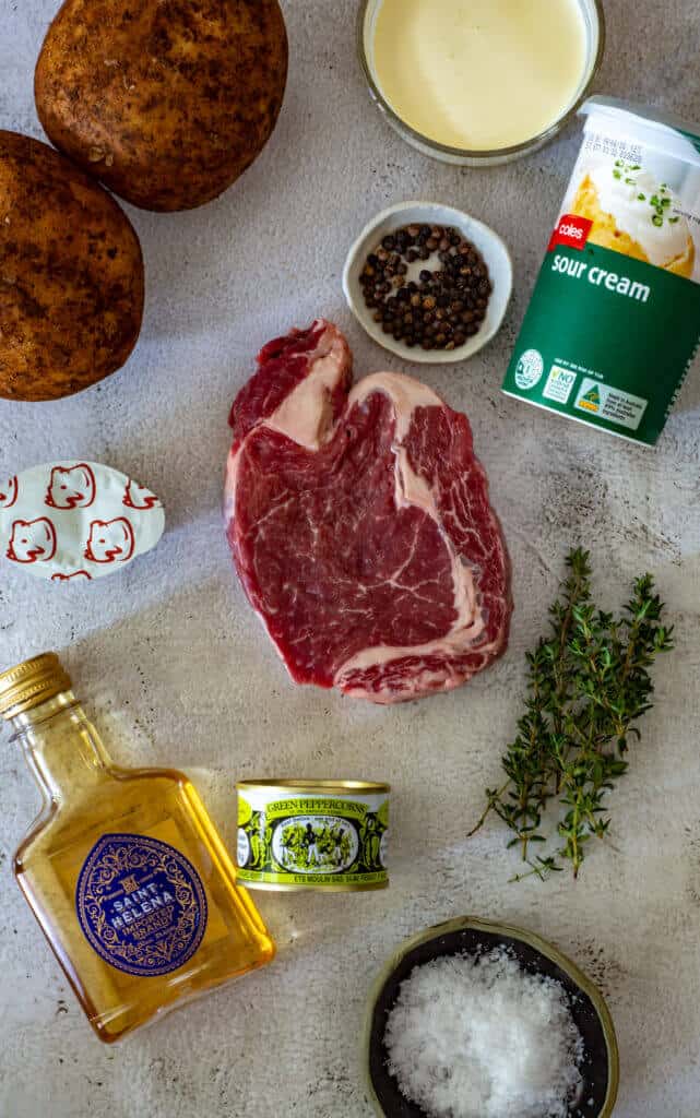 pepper sauce ingredients and a steak on a board