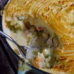 cooked fish pie on wooden board