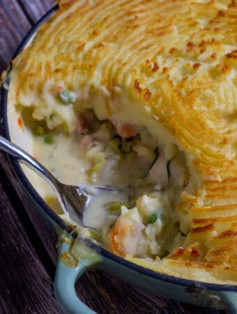 cooked fish pie on wooden board