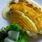 fish pie and salad on a plate