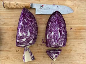 cut red cabbage & chefs knife on board