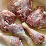 chicken thighs & drumsticks browning in pan