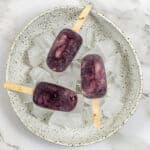 3 acai ice pops in a bowl of ice
