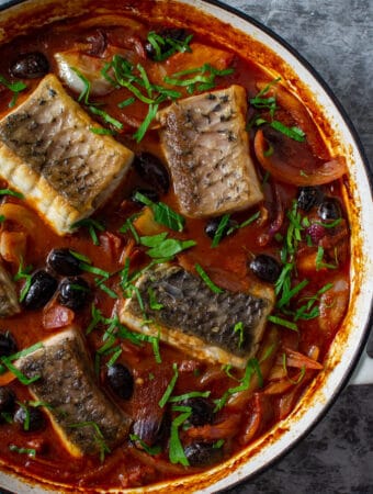 cooked spanish fish stew in casserole dish