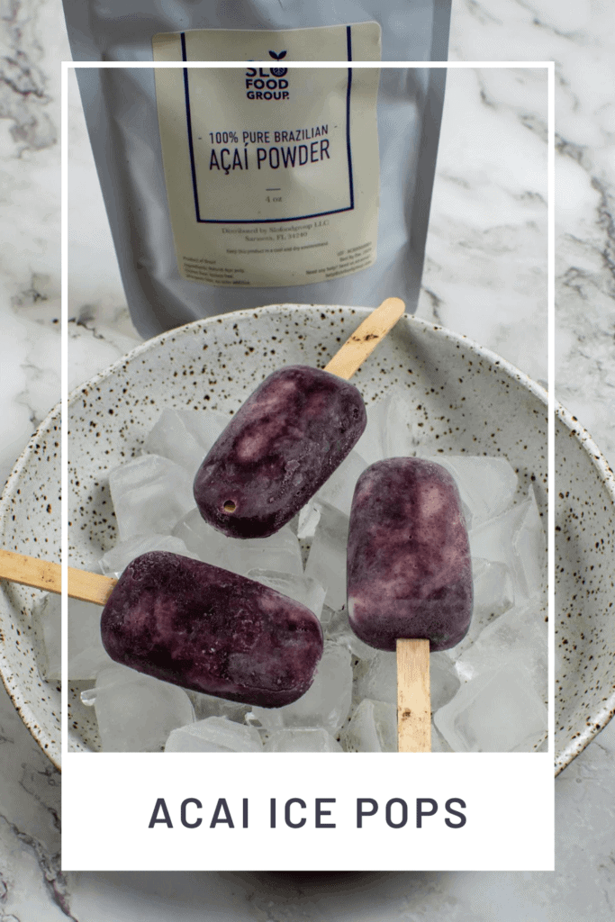 3 acai ice pops in a bowl of ice with packet of slofoodgrp acai