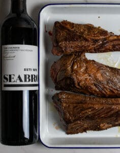 seared short ribs & bottle of seabrook cabernet sauvignon