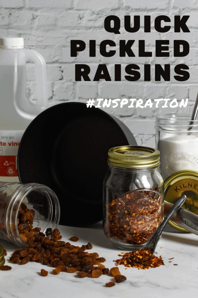 raisins, sugar & red chili flakes in kilner jars, global chef knives and a scanpan pot on kitchen counter top