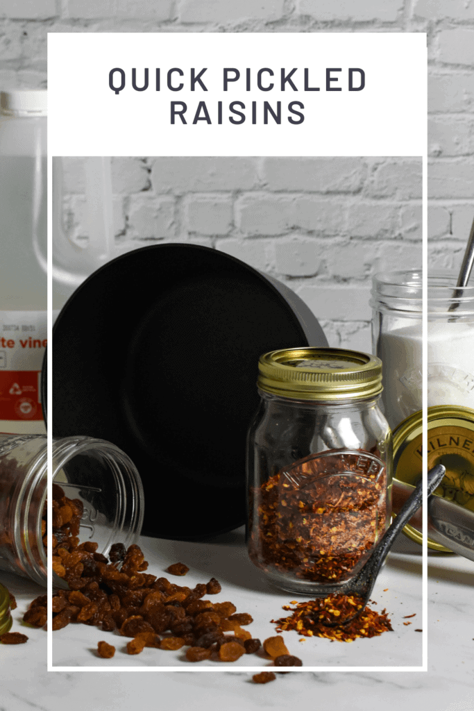 raisins, sugar & red chili flakes in kilner jars, global chef knives and a scanpan pot on kitchen counter top