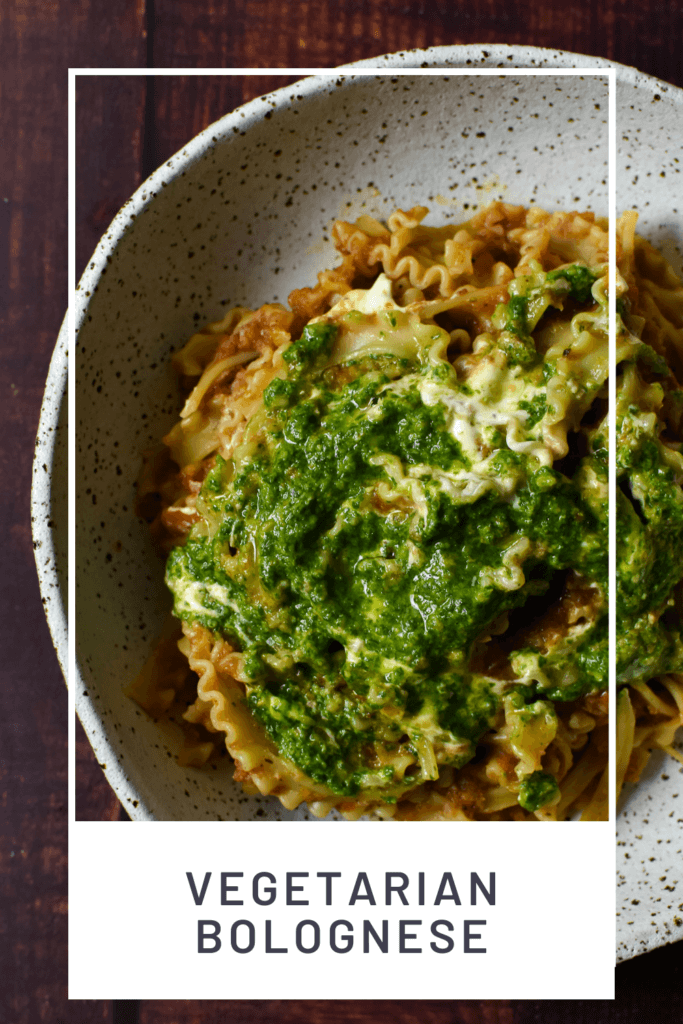 vegetable bolognese with basil pesto & creme fraiche in a bowl