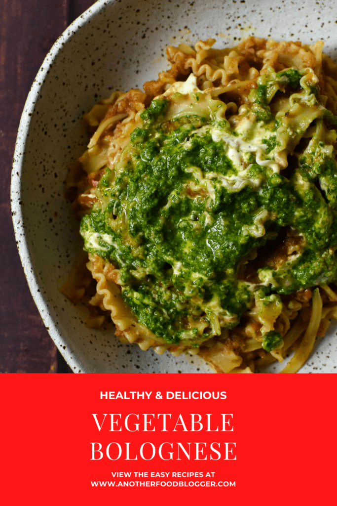 vegetable bolognese with basil pesto & creme fraiche in a bowl