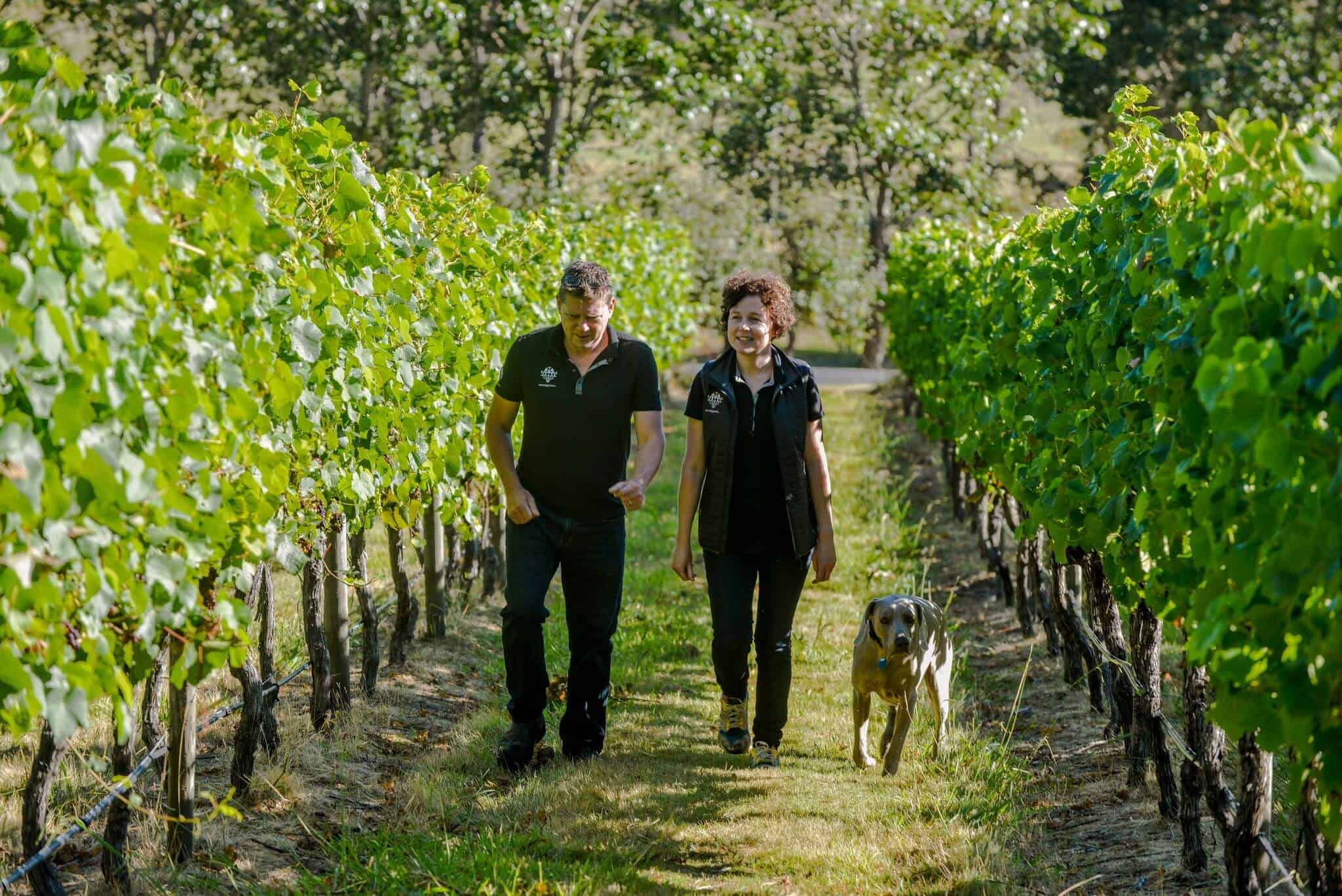 Moores Hill Winery owners walking in vineyard