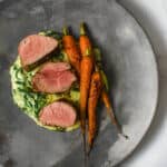 pork tenderloin, creamed spianch & carrots on a made of australia plate