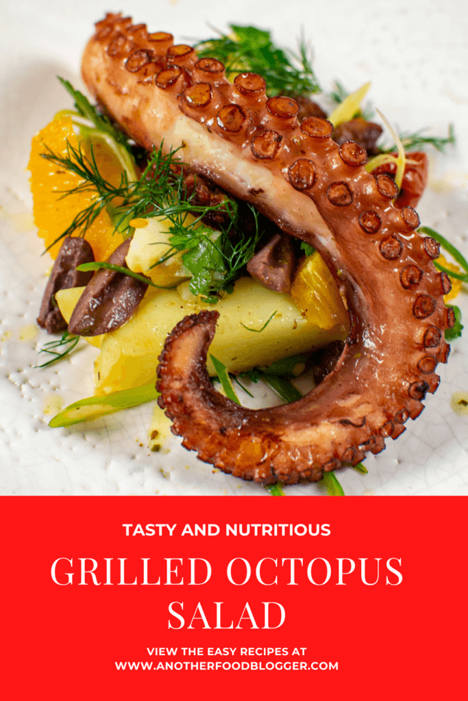 Grilled octopus salad on a white plate