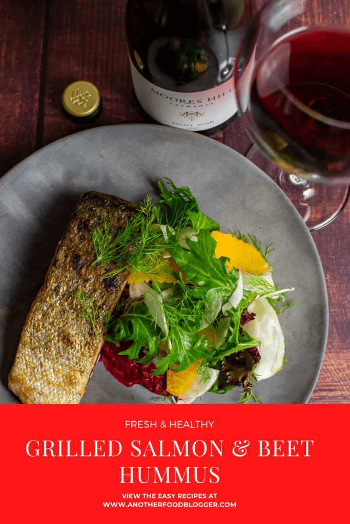 grilled salmon, beetroot hummus & fennel salad on a made of australia plate and a moores hill pinot noir